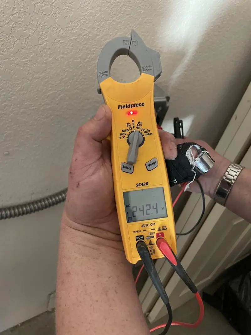 Voltage testing with clamp meter during Generator Installation in West Palm Beach